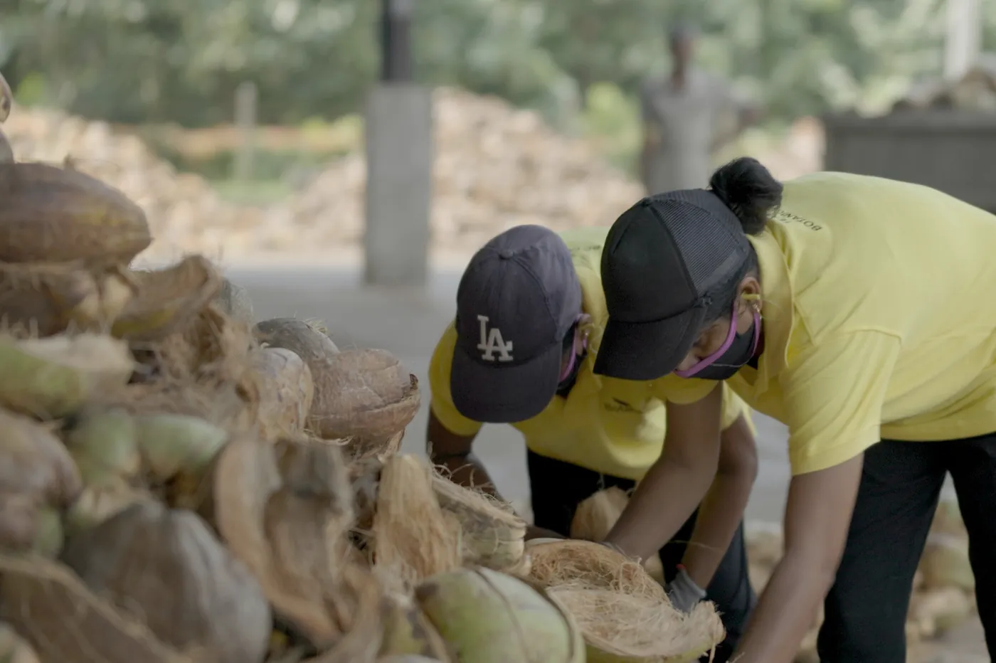 Botanicoir team members sorting coconut husks at a facility in Sri Lanka